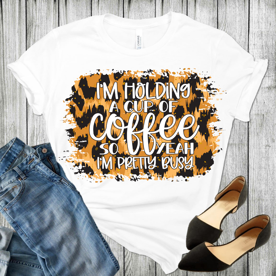I'm holding a cup of coffee